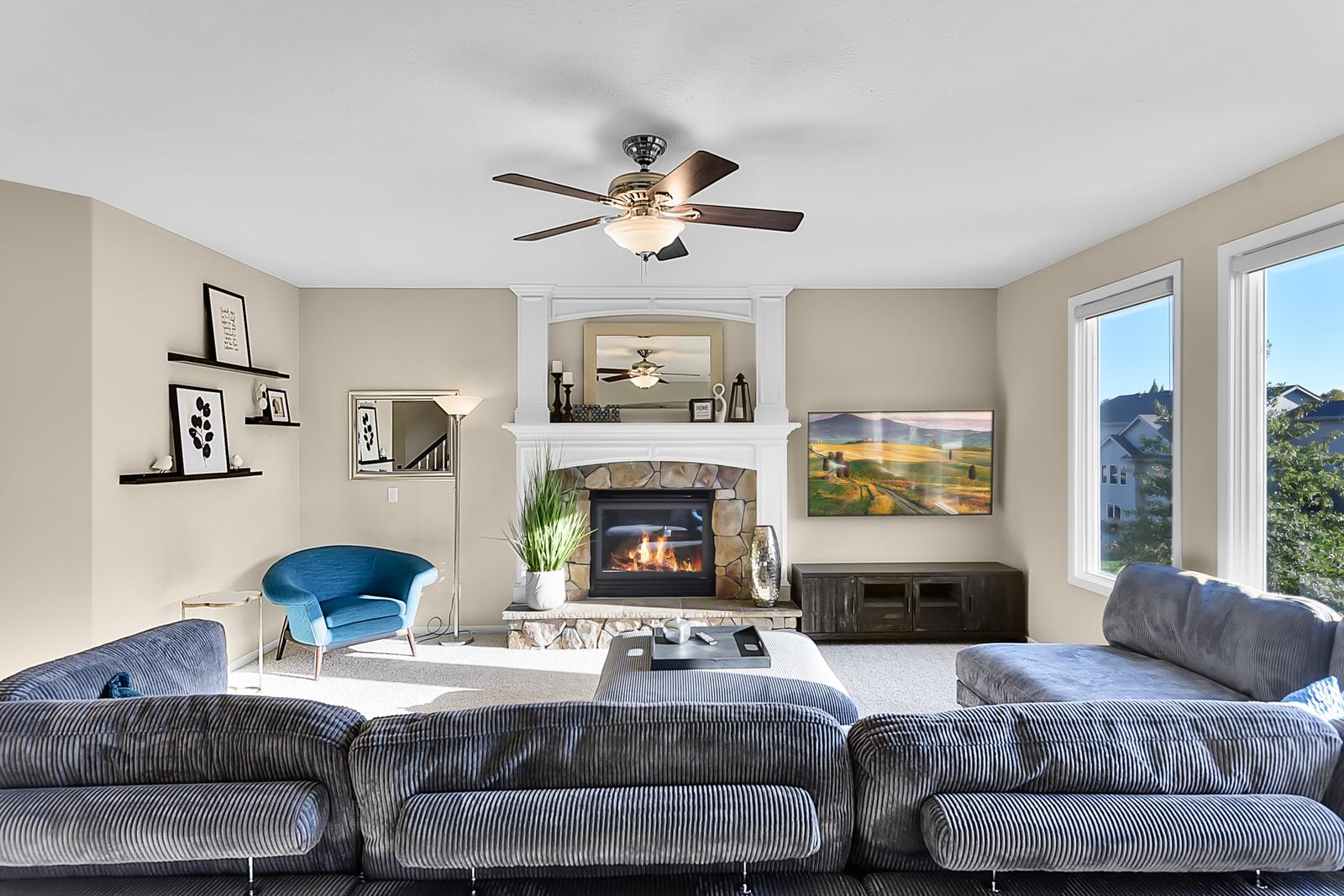 Sink into plush velvet seating while the fireplace crackles warmly, creating your perfect retreat for cozy evenings together.