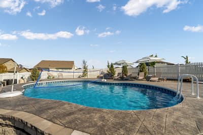 Dive into your private oasis! This sparkling pool offers the perfect escape with loungers and umbrellas for sunny afternoons.