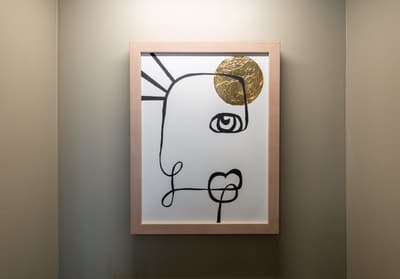 Modern abstract art adds personality to your space with its striking gold accent and minimalist design.