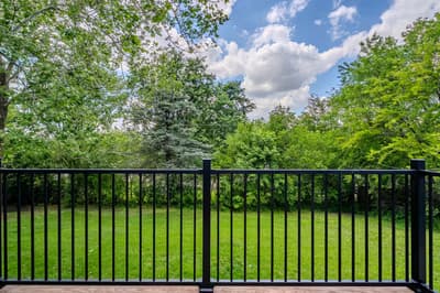 Step onto your private balcony and breathe in the fresh air while gazing at lush green lawns and towering trees.