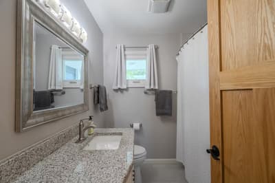 Freshen up in your private bathroom featuring granite countertops, premium fixtures, and fluffy towels—everything you need for a comfortable stay.