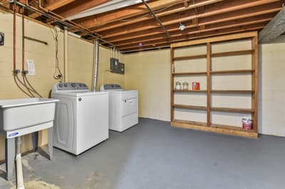 Your private laundry room offers full-size washer and dryer with ample shelving for storage and organization.