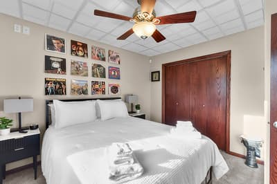 Unwind in your cozy bedroom featuring music-themed decor and crisp linens that invite a restful night's sleep.