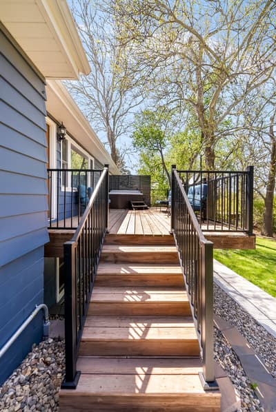 Step up to your private deck where morning coffee tastes better surrounded by towering trees and peaceful garden views.