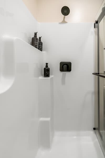 Step into your sleek modern shower with premium toiletries and rainfall showerhead for a refreshing, spa-like experience.