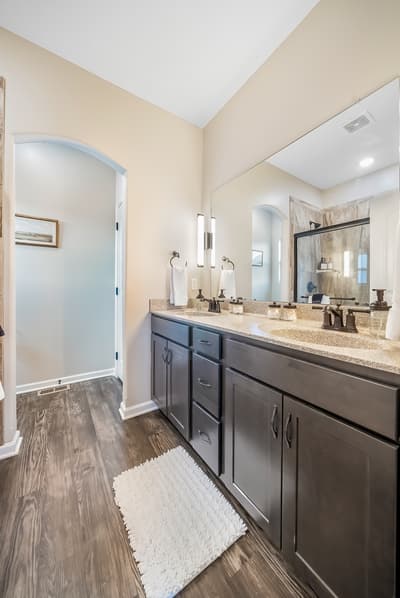 Your spacious master bathroom features elegant granite countertops and plenty of vanity space for your morning routine.