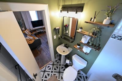 Your stylish bathroom features modern fixtures and thoughtful touches, with plush towels and toiletries ready for your comfort.