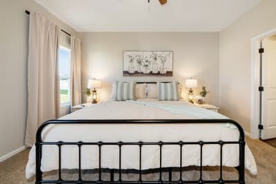 Drift into peaceful slumber in your cozy bedroom with soft linens and warm bedside lighting.