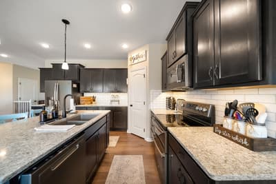 Your dream kitchen awaits with granite counters, stainless appliances, and ample space for cooking memorable meals together.