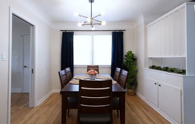 Gather around your elegant dining table for memorable meals with loved ones in this sophisticated space.