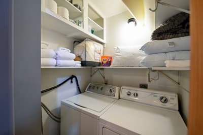 Your private laundry closet keeps you organized with fresh towels, linens, and convenient washer-dryer access.
