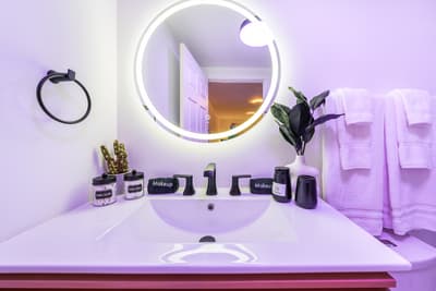 Your Instagram-ready bathroom features LED mirror lighting and luxury toiletries for the perfect morning routine.