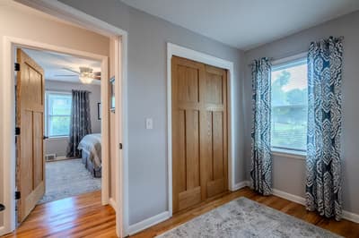 Step into your serene retreat with rich hardwood floors, elegant curtains, and spacious closets for all your belongings.