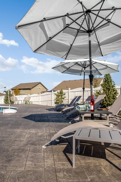 Soak up the sun on your private pool deck with comfortable loungers and shaded umbrellas for the perfect poolside relaxation.