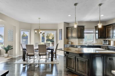 Cook memorable meals in this elegant kitchen featuring granite countertops, rich cabinetry, and modern appliances that make your stay feel like home.