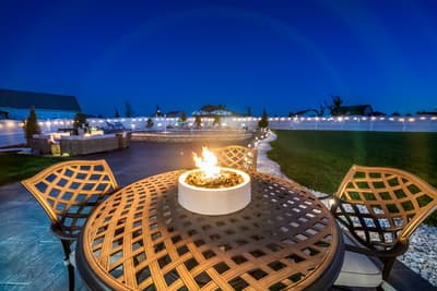 Gather around your private fire pit for cozy evening conversations under the stars, with comfortable seating and ambient lighting creating perfect moments.