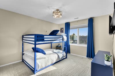 Your kids will love this bright bedroom with comfortable bunk beds and city views through large windows.