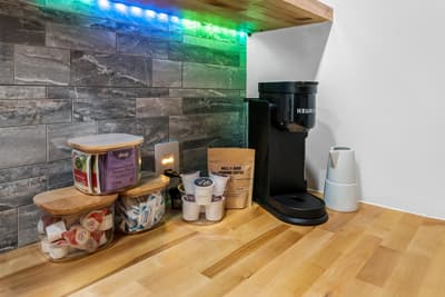 Start your mornings with fresh coffee from the Keurig station, complete with premium beans and creamer—everything you need for that perfect cup.
