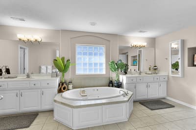 Unwind in your spa-like master bathroom, featuring a luxurious soaking tub, dual vanities, and elegant finishes for ultimate relaxation.