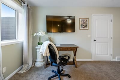Your private workspace awaits with elegant furnishings, natural light, and modern entertainment for productive mornings or relaxing evenings.