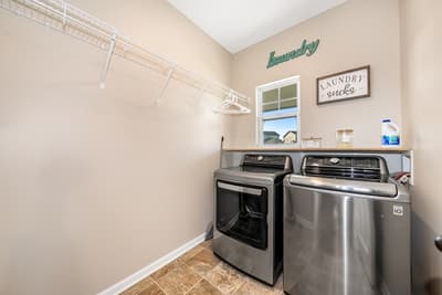 Your dedicated laundry room makes vacation packing a breeze with full-size washer and dryer, hanging space, and cheerful decor.