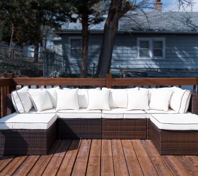 Unwind on your private deck with plush seating surrounded by peaceful winter scenery and cozy outdoor comfort.