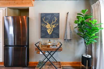 Mix your favorite cocktails at this stylish bar cart, surrounded by thoughtful touches and natural light.