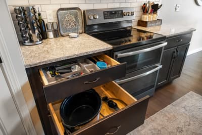 Your fully-equipped kitchen features smart organization with pull-out drawers and quality appliances to make cooking effortless.