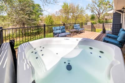 Soak your worries away in this private hot tub while surrounded by peaceful treetops and comfortable deck seating.