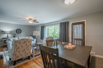 Gather around your spacious dining table while soft natural light filters through, creating the perfect setting for memorable meals together.