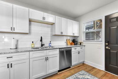 Your modern kitchen features granite counters, stainless appliances, and bright white cabinetry for effortless meal prep.
