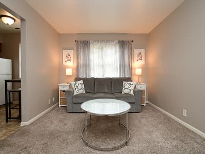 Step into your cozy living space with soft lighting and plush seating. Unwind on the sofa with a good book, enjoy quiet conversations, or simply let the gentle glow of the lamps ease you into a peaceful evening.