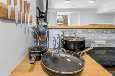 Your fully-equipped kitchen features professional cookware and quality knives, perfect for preparing memorable meals during your stay.