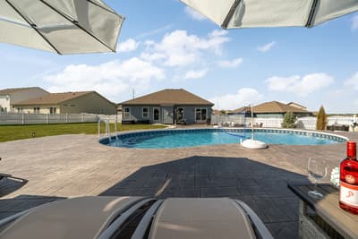 Soak up the sunshine by your private pool, where crystal-clear waters invite a refreshing dip beneath open prairie skies.