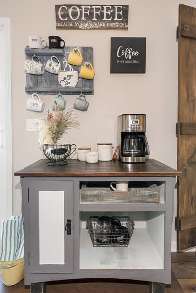 Your charming coffee station awaits with a sleek machine, adorable mug collection, and rustic farmhouse charm to start mornings perfectly.