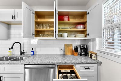 Your fully equipped kitchen awaits with granite counters, stainless appliances, and thoughtfully stocked cabinets for effortless meal prep.