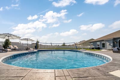 Dive into your private oasis! This sparkling pool beckons with crystal-clear waters, surrounded by comfortable loungers under shady umbrellas for perfect relaxation.