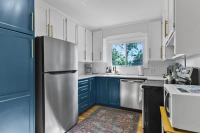 Your fully equipped kitchen features elegant two-tone cabinetry, stainless steel appliances, and everything you need to cook memorable meals during your stay.