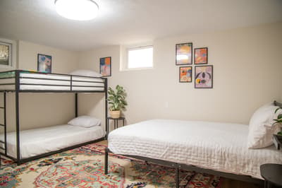 Your colorful retreat features a cozy bunk bed and comfortable twin bed, perfect for friends or family sharing adventures together.
