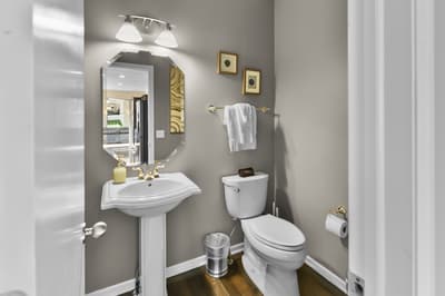 Freshen up in your private powder room, complete with modern fixtures and thoughtful touches for your comfort.